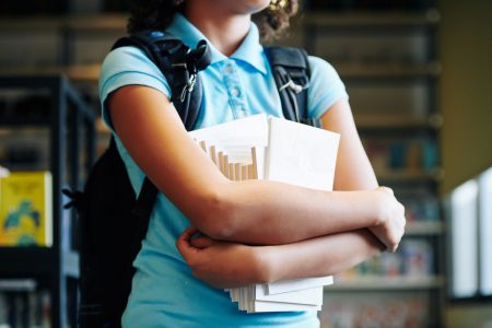 Schoolgirl with textbooks